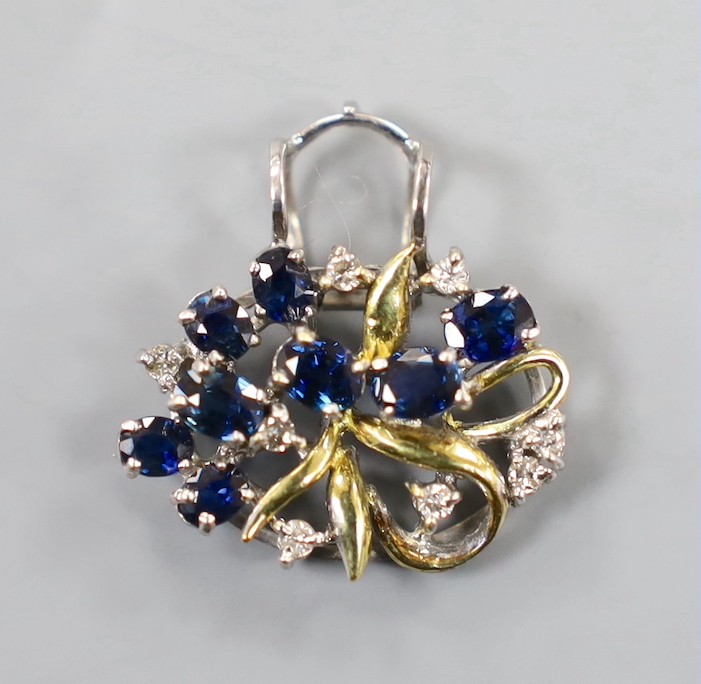 A yellow and white metal, sapphire and diamond cluster set oval pendant, 20mm, gross weight 3.8 grams.